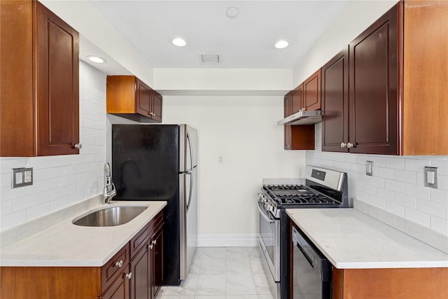 kitchen with visible vents, marble finish floor, stainless steel appliances, under cabinet range hood, and a sink