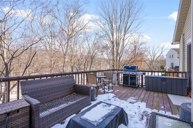 snow covered deck with area for grilling