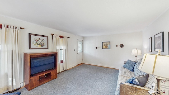 living room with carpet flooring and ornamental molding