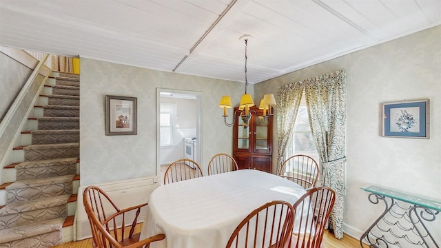 dining room featuring a chandelier and light hardwood / wood-style floors