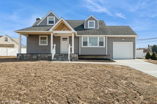 view of front of home featuring a garage, concrete driveway, a shingled roof, and fence