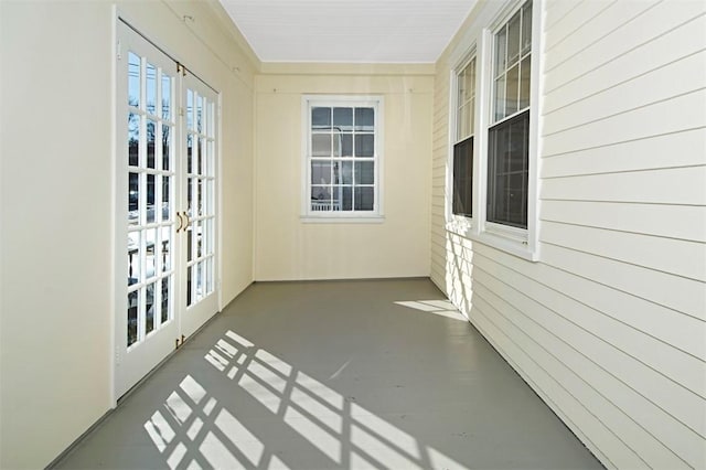 unfurnished sunroom featuring french doors