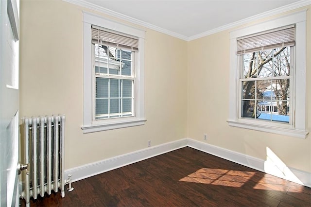 unfurnished room with ornamental molding, baseboards, plenty of natural light, and radiator heating unit