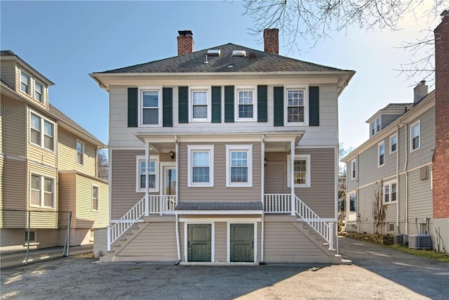 view of front facade with a chimney