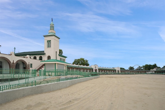 view of community with fence