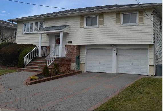 bi-level home featuring a garage