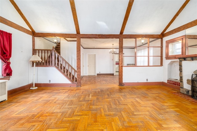 unfurnished living room featuring lofted ceiling with beams, baseboards, and stairs