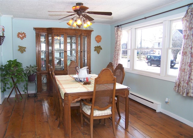 dining space featuring baseboards, a baseboard radiator, ornamental molding, and hardwood / wood-style floors