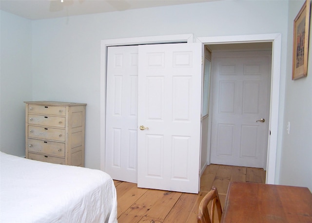 bedroom featuring a closet and light wood finished floors