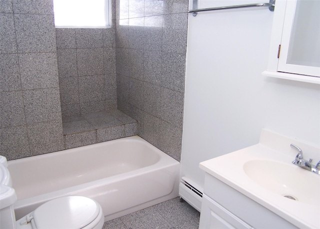 full bath with baseboard heating, vanity, and toilet