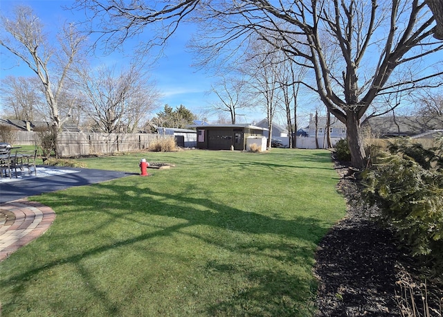 view of yard with a patio and fence