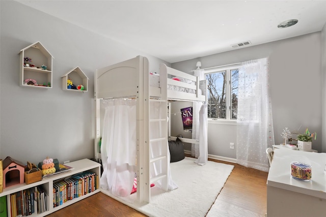 bedroom featuring hardwood / wood-style floors