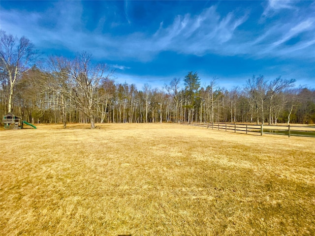 view of yard with playground community and fence