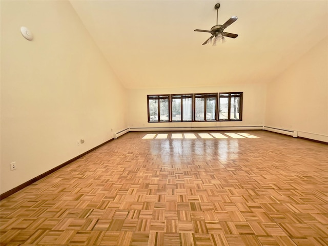 interior space featuring ceiling fan, high vaulted ceiling, and baseboards