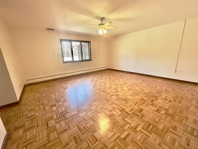 empty room with visible vents, baseboards, baseboard heating, and a ceiling fan