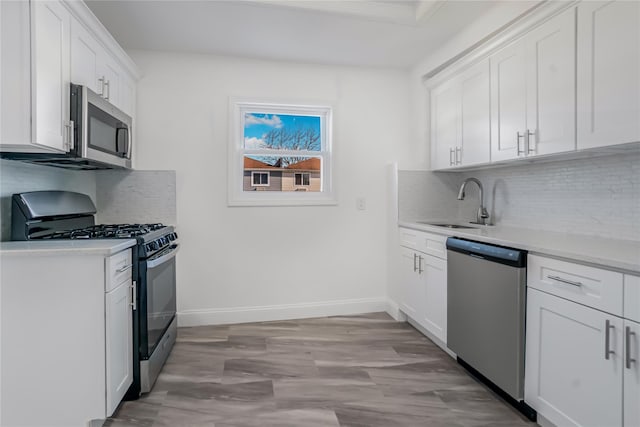 kitchen with appliances with stainless steel finishes and white cabinets