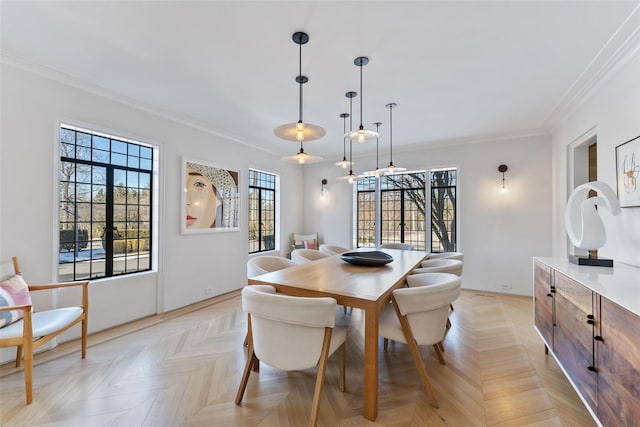 dining space with ornamental molding