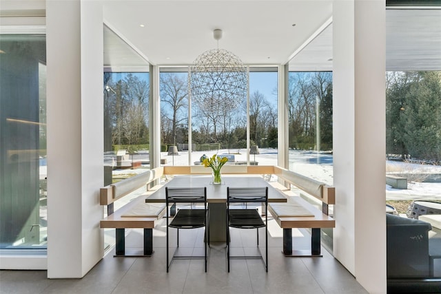 sunroom with an inviting chandelier