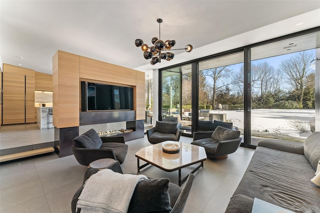 tiled living area with a chandelier and floor to ceiling windows