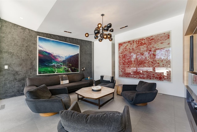 living area featuring visible vents and a notable chandelier