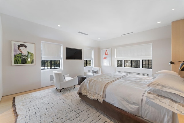 bedroom with recessed lighting, visible vents, and light wood-style flooring