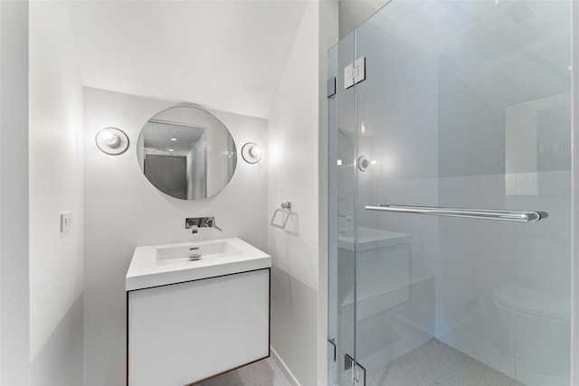 bathroom featuring a stall shower and vanity