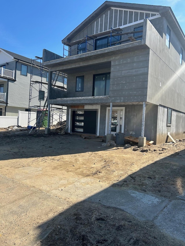 view of front of property featuring a garage, driveway, and board and batten siding