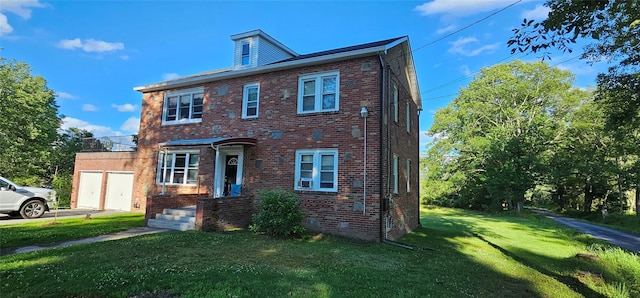 view of front of house with an attached garage, crawl space, a front lawn, and brick siding