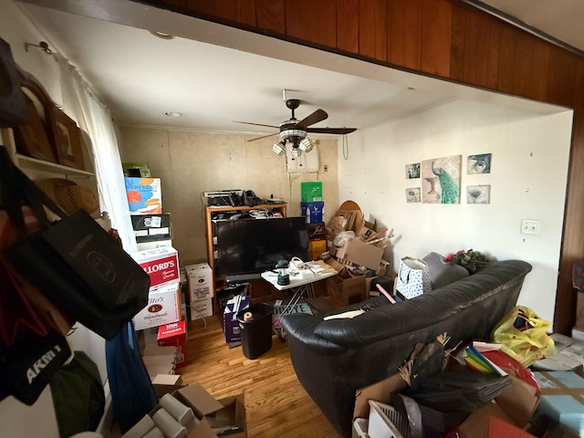 living room with ceiling fan and light wood-style flooring