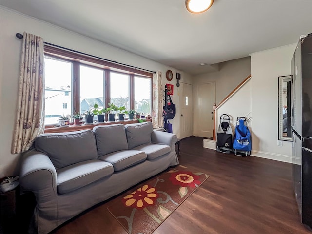 living area featuring dark wood-style floors and baseboards