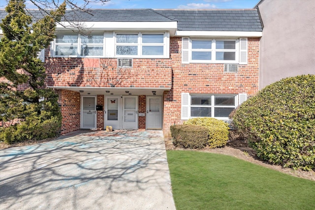 view of property featuring brick siding