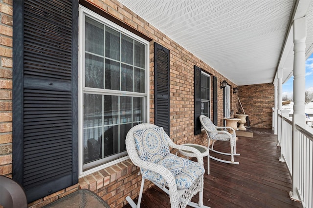 wooden terrace featuring a porch