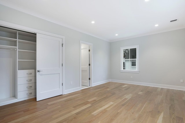 unfurnished bedroom with baseboards, visible vents, and light wood-style floors