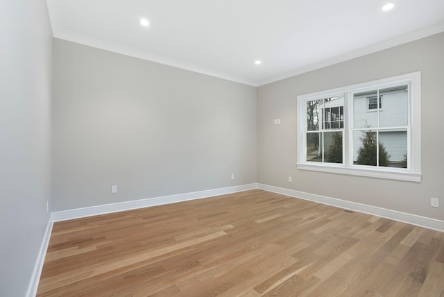 spare room featuring ornamental molding and baseboards