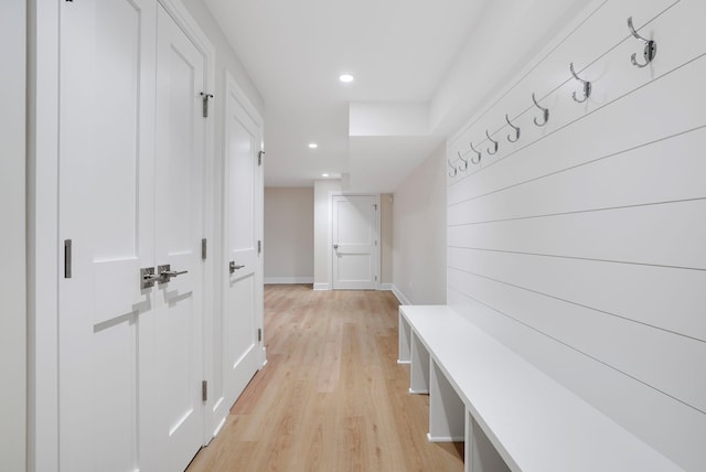 mudroom with baseboards, recessed lighting, and light wood-style floors