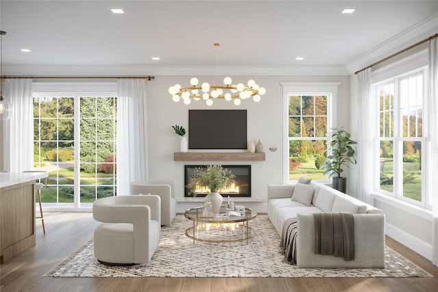 630 Forest Ave, Rye, NY 10580 - living area with a notable chandelier, wood finished floors, a glass covered fireplace, crown molding, and baseboards