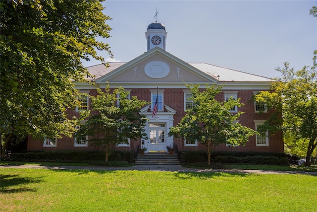 630 Forest Ave, Rye, NY 10580 - view of front facade with brick siding and a front yard