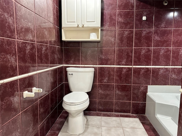 bathroom featuring tile walls, toilet, and tile patterned floors