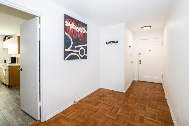 hallway featuring baseboards