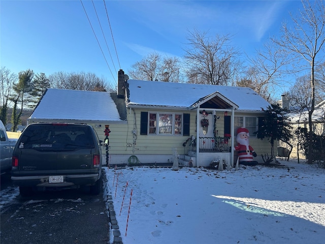 view of front of house with a garage and a chimney