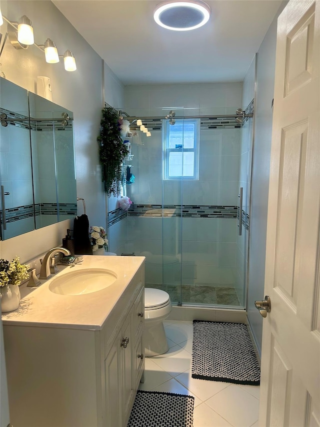 110-37 213th St, Queens Village, NY 11429 - bathroom with vanity, tile patterned flooring, an enclosed shower, and toilet