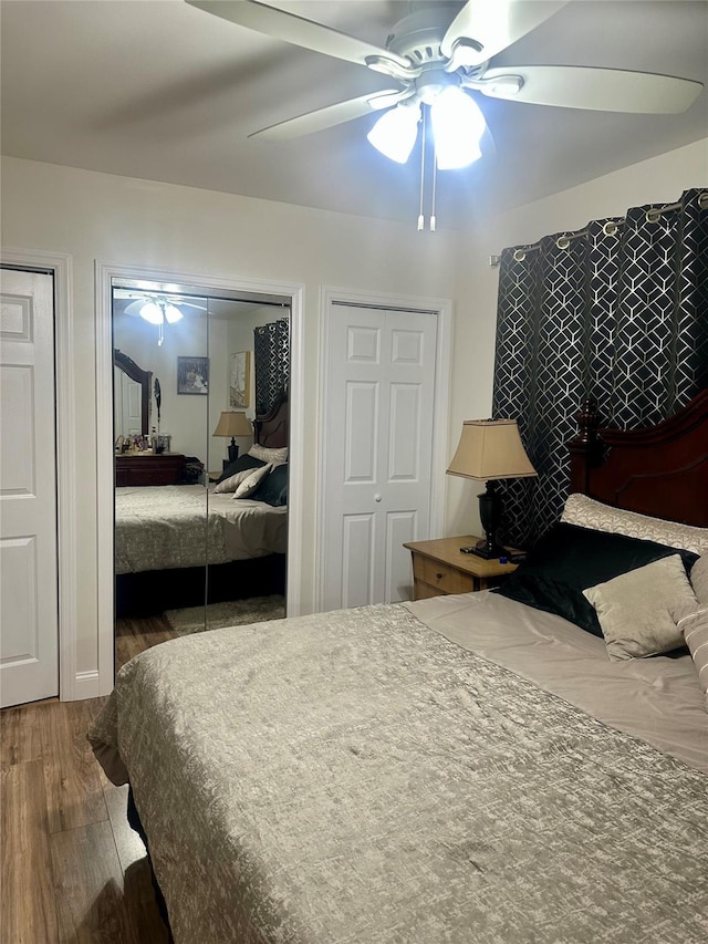 110-37 213th St, Queens Village, NY 11429 - bedroom with ceiling fan, dark wood-type flooring, and two closets
