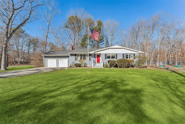 ranch-style home featuring driveway, a chimney, an attached garage, fence, and a front yard