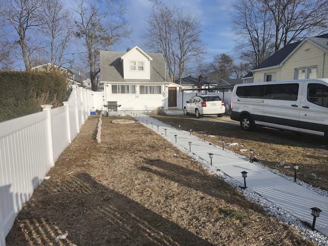 snowy yard with a carport