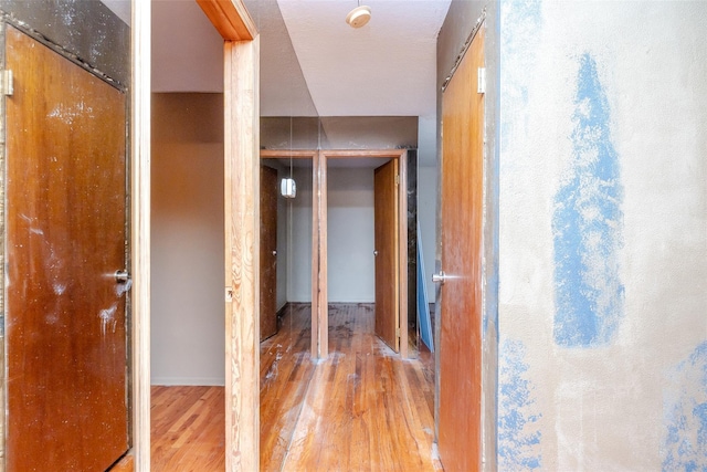 hallway featuring hardwood / wood-style flooring