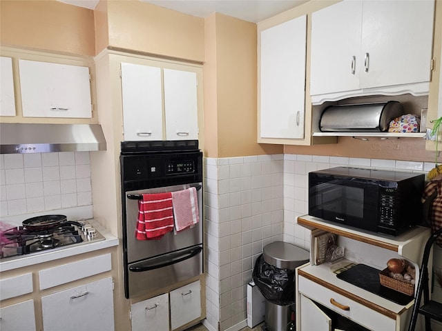 kitchen with white gas cooktop, white cabinets, black microwave, oven, and under cabinet range hood