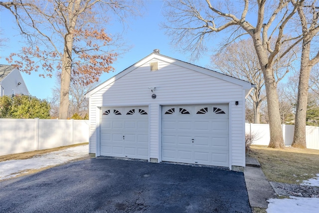 detached garage with fence