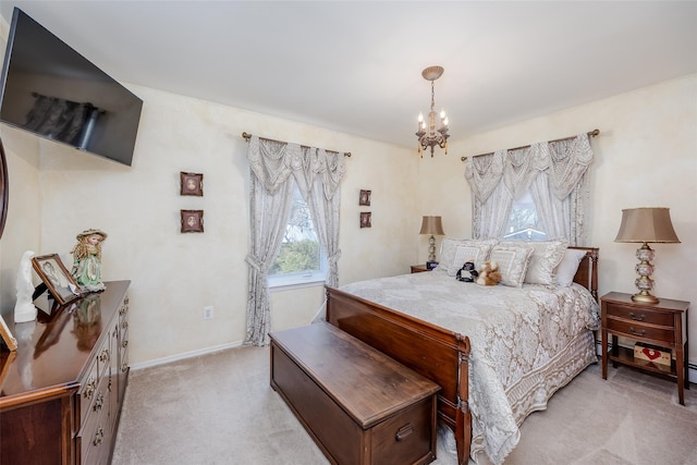 bedroom with light colored carpet, a notable chandelier, and baseboards