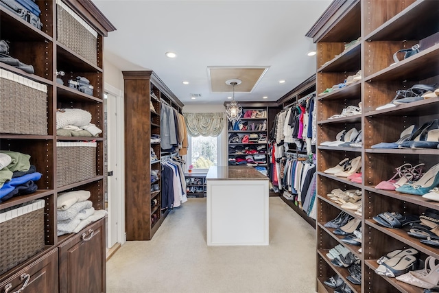 spacious closet featuring light carpet