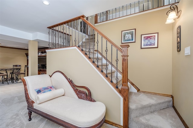 staircase with carpet floors, baseboards, and recessed lighting